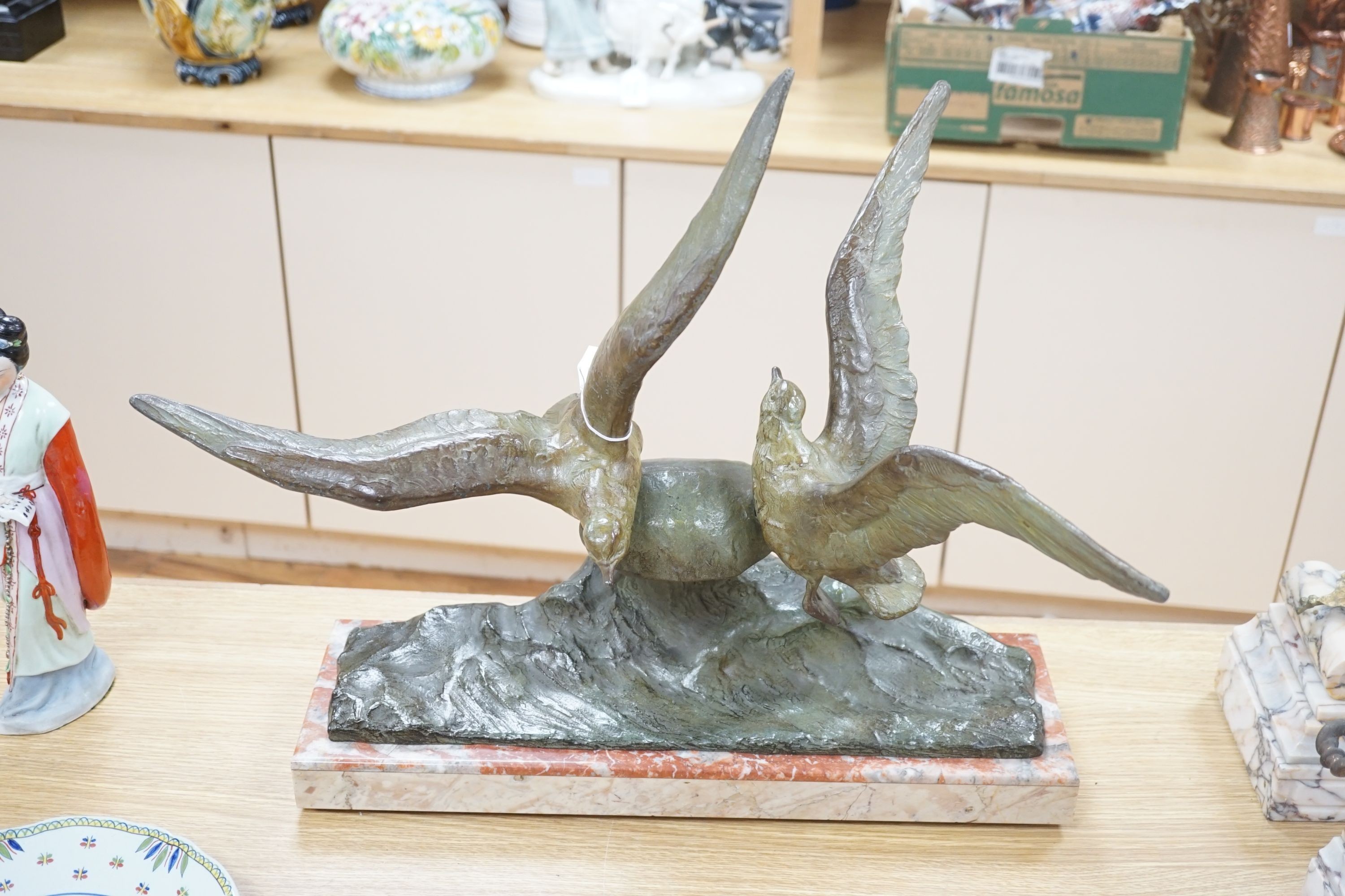 An Art Deco bronzed metal gull and wave group on marble base, signed Rene Papa, 52cm